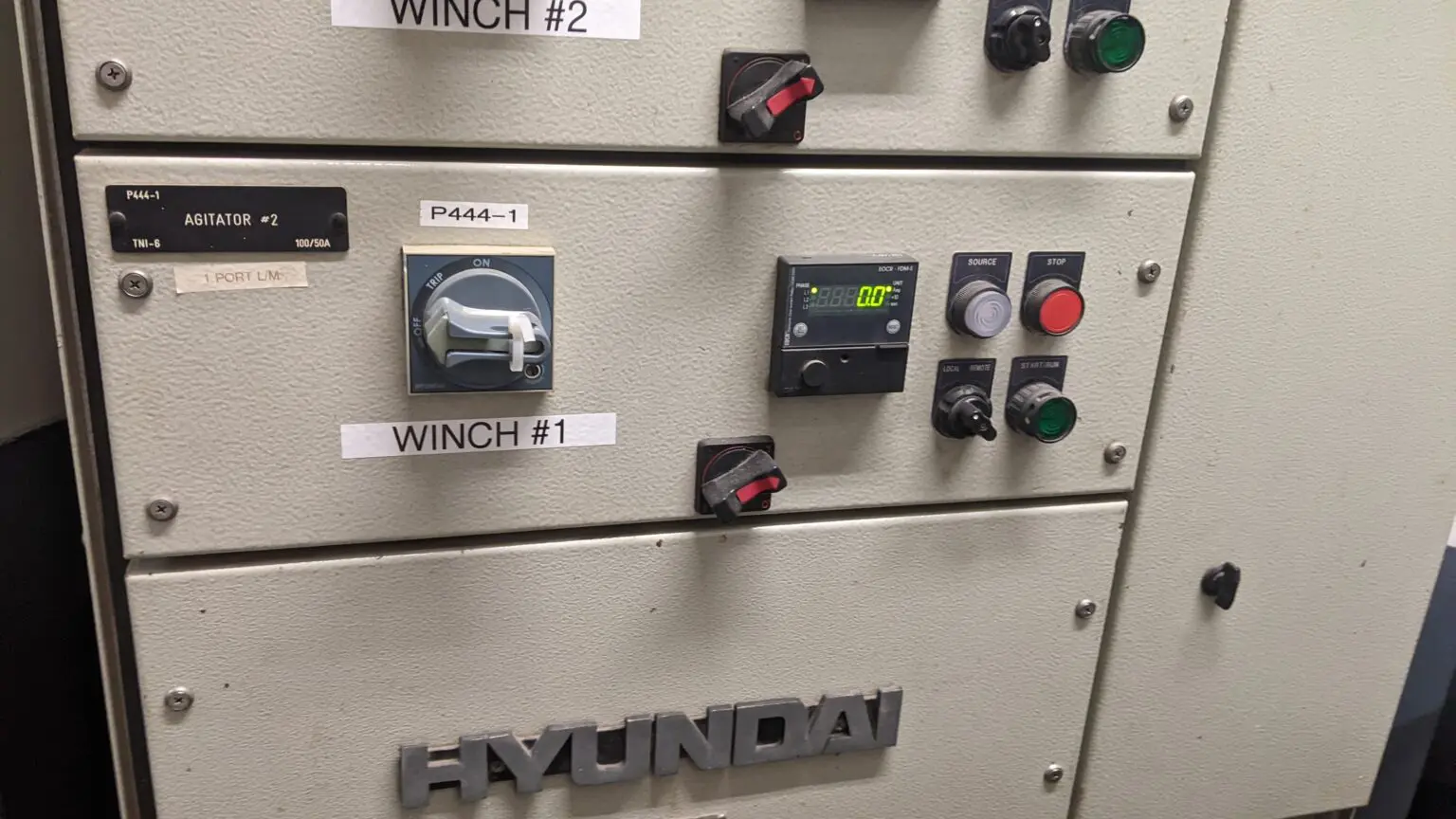A control panel with several different buttons and switches.