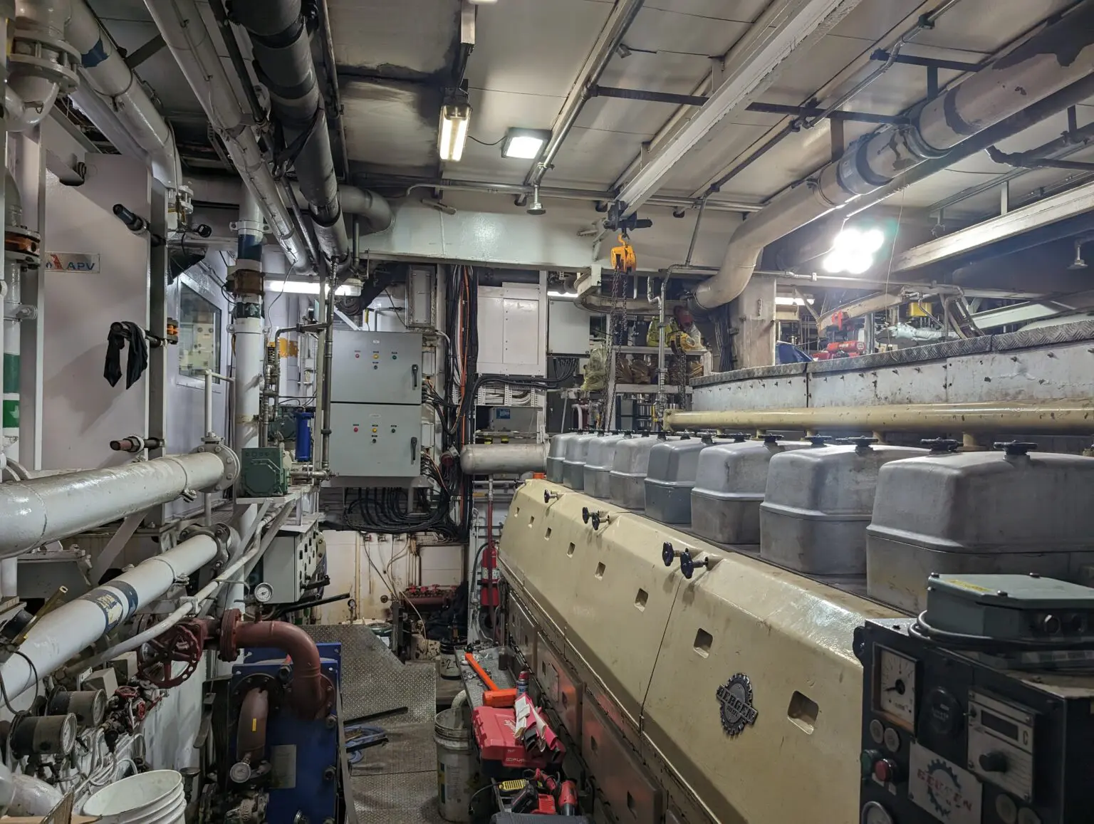 A large room with many pipes and other equipment.
